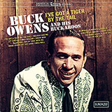 Download or print Buck Owens I've Got A Tiger By The Tail Sheet Music Printable PDF 3-page score for Country / arranged Piano, Vocal & Guitar Chords (Right-Hand Melody) SKU: 52637